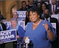  ?? BOB ANDRES/ATLANTA JOURNAL-CONSTITUTI­ON FILE PHOTOGRAPH ?? Democrat Stacey Abrams speaks to supporters on March 6, when she qualified to run for governor.