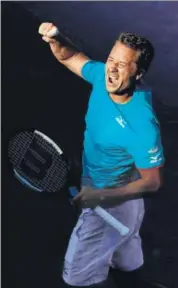  ?? AFP ?? Philipp Kohlschrei­ber reacts after beating Novak Djokovic.