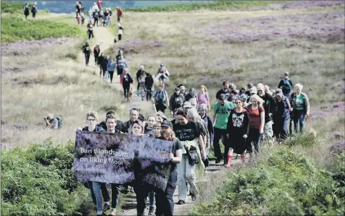  ??  ?? Campaigner­s from Ban Bloodsport­s in a protest ramble on Ilkley Moor in 2017, to oppose the last grouse shooting season.