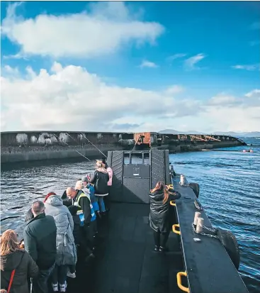  ?? Andrew Cawley ?? Passengers on board the Tonka view the sugar boat wreck which sank in 1974 and, above, skipper Ronnie Doolan
Pictures