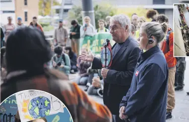  ?? PHOTOS: ALDEN WILLIAMS/THE PRESS ?? Christchur­ch mayor Phil Mauger, flanked by staff and security, meets with climate protesters yesterday.