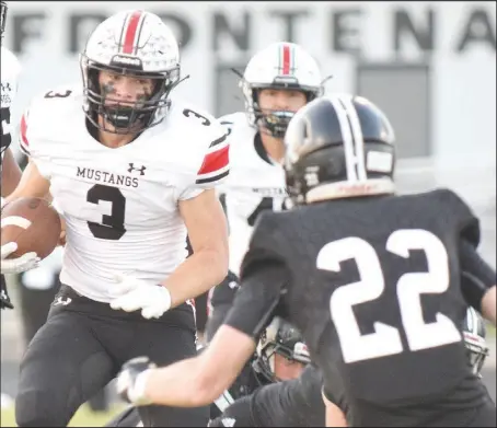  ?? RICK PECK/ SPECIAL TO MCDONALD COUNTY PRESS ?? McDonald County running back Bailey Lewis runs for good yardage before trying to get past Frontenac’s Marion Menghini (22) during the Mustangs’ 39-13 win on Sept. 25 at Frontenac High School.