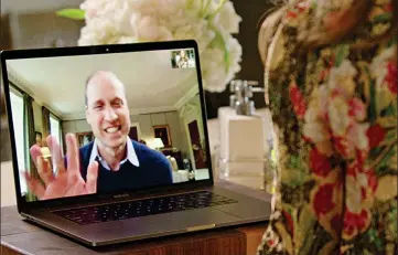  ??  ?? Royal wave: The Prince grinning in the video as he talks to Lady Gaga over the internet