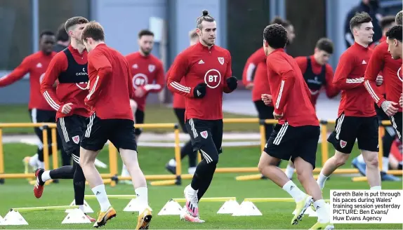  ??  ?? Gareth Bale is put through his paces during Wales’ training session yesterday PICTURE: Ben Evans/ Huw Evans Agency