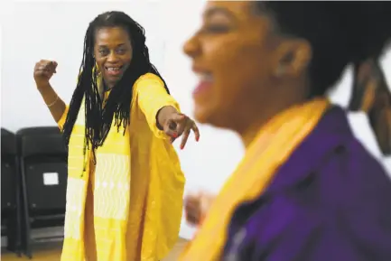  ?? Photos by Scott Strazzante / The Chronicle ?? Director Ayodele Nzinga and actor Venus Morris warm up before a Lower Bottom Playaz rehearsal in December.