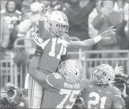  ?? JAY LAPRETE/AP ?? Receiver Chris Olave celebrates after scoring a TD during Ohio State’s victory Saturday.