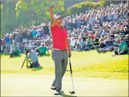  ?? PHOTO/RYAN KANG] ?? Adam Scott, of Australia, reacts after winning the Genesis Invitation­al golf tournament at Riviera Country Club on Sunday in the Pacific Palisades area of Los Angeles. [AP