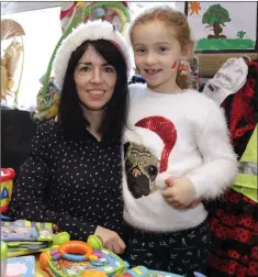  ??  ?? Tara Kelly and Sadhbh O’Toole running the toy stall.