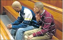  ?? Picture: DEVON KOEN ?? IN THE DOCK: Murder accused Deswin Kleinbooi, left, and Eston Afrikaaner at the Port Elizabeth High Court