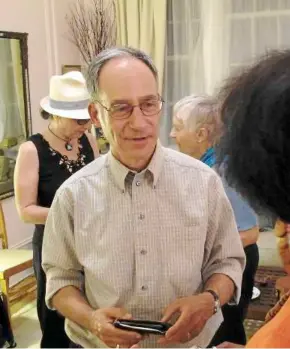  ??  ?? Not your usual conversati­ons: robb Kushner talks with alicia evans (back to camera) during a death cafe discussion in a new york city apartment. at rear are Marjorie Lipari (left) and discussion leader Jane Hughes Gignoux. death cafes, where people...