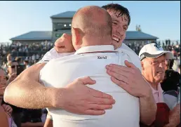  ??  ?? DELIGHT: Paddy Brophy of Kildare celebrates among the fans and (right) the Meath defence tries to stop Lilywhites danger man Daniel Flynn