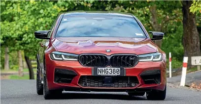  ?? NILE BIJOUX/STUFF ?? The M5 Competitio­n can be spotted by the black grille. It also has a small rear spoiler and subtle Competitio­n badging, but chances are it will beway in the distance before you can get a good look.