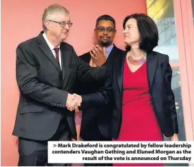  ??  ?? &gt; Mark Drakeford is congratula­ted by fellow leadership contenders Vaughan Gething and Eluned Morgan as the result of the vote is announced on Thursday