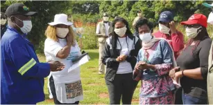  ??  ?? Mrs Madeline Manyika and her daughters greet Lands, Agricultur­e, W ater and Rural Resettleme­nt Minister Perrance Shiri at a field day recently