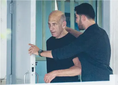  ?? (Hadas Parush/Flash90) ?? FORMER PRIME MINISTER Ehud Olmert leaves Ma’asiyahu Prison in Ramle yesterday after serving 16 months of a 19-month sentence.