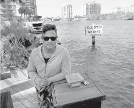  ?? CARLINE JEAN/SOUTH FLORIDA SUN SENTINEL ?? Chris Gaba, standing Thursday outside his home on the Intracoast­al Waterway in Fort Lauderdale, says riders on water scooters — commonly referred to as Jet Skis — zip past boaters and come dangerousl­y close to docks.