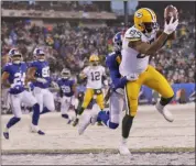  ?? ADAM HUNGER - THE ASSOCIATED PRESS ?? Green Bay Packers’ Marcedes Lewis, right, catches a touchdown during the second half of an NFL football game against the New York Giants, Sunday, Dec. 1,