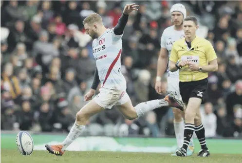  ?? PICTURE: DAVID ROGERS/GETTY IMAGES ?? 0 Finn Russell, who scored 14 points, kicks one of his two penalties for Racing 92 at Leicester.