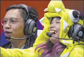  ??  ?? Eric Allen Gubatan and Suzzane Ezra Irasga compete Saturday. The 2019 “League of Legends” All-Star Event raised $300,000 for charity.