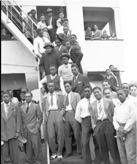  ?? (Photo: AP) ?? In this June 22, 1948 file photo, Jamaican men, mostly ex Royal Air Force servicemen, pose for a photo aboard the former troopship, SS Empire Windrush, before disembarki­ng at Tilbury Docks, England.