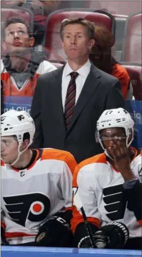  ?? THE ASSOCIATED PRESS FILE ?? Considerin­g Ron Hextall, the man who brought him to Philly, is now gone, you probably couldn’t blame coach Dave Hakstol for being a little wide-eyed in surprise that he was still behind the Flyers’ bench Tuesday night when the club hosted the Ottawa Senators.