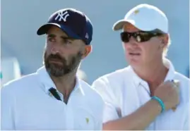  ??  ?? Internatio­nal team assistant captains Geoff Ogilivy [left] and Ernie Els at the 2017 Presidents Cup.
The 16th hole at Metropolit­an GC [top].