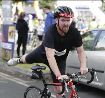  ??  ?? Sean O’Toole taking part in the King of Greystones Triathalon.