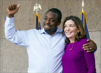  ?? AP PHOTO/MARY ALTAFFER ?? State Sen. Brian Benjamin embraces Gov. Kathy Hochul during an event in the Harlem neighborho­od of New York on Thursday in New York. Hochul has selected Benjamin as her choice for lieutenant governor.