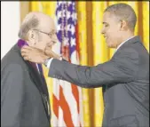  ?? The Associated Press ?? President Barack Obama presents a National Medal of Arts to “I NY” logo designer Milton Glaser in 2010.