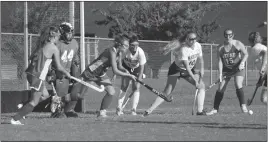  ?? STAFF PHOTO BY JOHN NISWANDER ?? La Plata and Thomas Stone battle for a loose ball in front of the cage during Monday’s contest. The Warriors prevailed 2-1 over the Cougars.