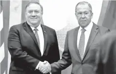  ?? photo — AFP ?? Lavrov (right) shakes hands with Pompeo during a meeting in Sochi.