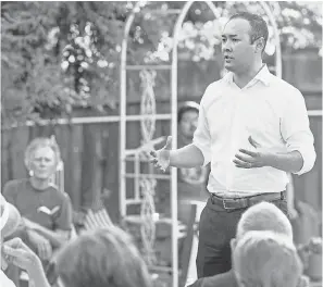  ?? RON HOLMAN ?? Democratic congressio­nal candidate Andrew Janz spends time with supporters during a barbecue at a Visalia, Calif., home July 13.