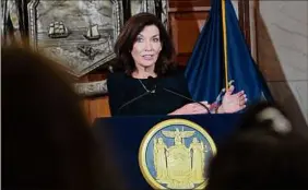  ?? Lori Van Buren / Times Union ?? Gov. Kathy Hochul answers questions at a COVID-19 briefing at the Capitol on Tuesday, as she pushed for a broader vaccine mandate.