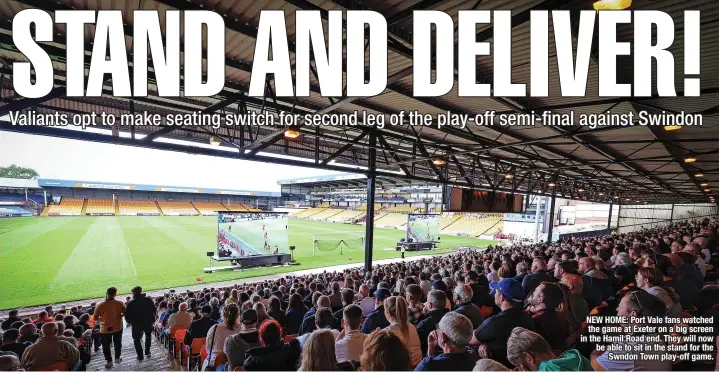  ?? ?? NEW HOME: Port Vale fans watched the game at Exeter on a big screen in the Hamil Road end. They will now be able to sit in the stand for the Swndon Town play-off game.