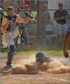  ?? PETE BANNAN — DIGITAL FIRST MEDIA ?? Wissahicko­n catcher JT Culp can only watch as Marple Newtown’s Reilly Fillman explodes into the dust, scoring one of three Marple Newtown runs knocked in by Luke Zimmerman in the fifth inning. The Tigers went on to a victory in the PIAA District 1...