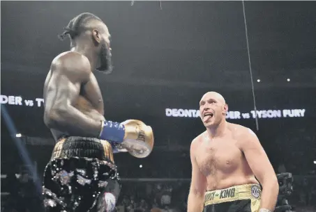  ??  ?? Deontay Wilder and Tyson Fury.