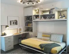  ?? HAYLEY HUDSON ?? California Closets can create a home office almost anywhere there is some space. Above, floating wall units and wall beds are especially popular solutions.