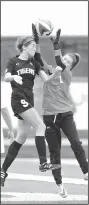  ?? NWA Democrat-Gazette/ BEN GOFF • @NWABENGOFF ?? Emma Welch (9) of Bentonvill­e High tries to head the ball into the goal as Rogers High goalkeeper Mackenzie Brace grabs the ball Friday at Whitey Smith Stadium in Rogers.