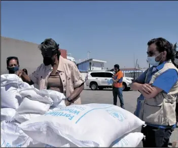  ?? AP US EMBASSY IN TURKEY VIA ?? In this photo provided by the US Embassy in Turkey, Linda Thomas-Greenfield, U.S. Ambassador to the United Nations, examines aid materials at the Bab alHawa border crossing between Turkey and Syria, on 2021.