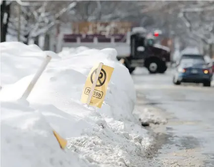  ?? ALLEN McINNIS ?? With snow-clearing in full force, Josh Freed says he’d had to rush out to move his car five days this week and has been towed once.