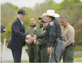  ?? EVAN VUCCI/AP ?? President Joe Biden speaks with Border Patrol and local officials Thursday during a visit to the U.S.-Mexico border in Brownsvill­e, Texas.