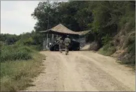  ?? VER—NICA G. CÁRDENAS VIA AP ?? National Guard troops guard the border in Roma, Texas, on Tuesday. The deployment of National Guard members to the U.S.-Mexico border at President Donald Trump’s request was underway Tuesday with a gradual ramp-up of troops under orders to help curb...