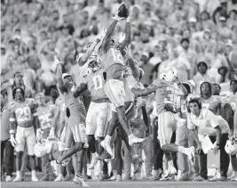  ?? AL DIAZ adiaz@miamiheral­d.com ?? Volunteers defensive back Tamarion McDonald intercepts a pass by Tigers quarterbac­k Cade Klubnik in the fourth quarter on Friday at Hard Rock Stadium in Miami Gardens.