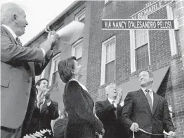  ?? AMY DAVIS/BALTIMORE SUN ?? In January 2007, Mayor Martin O'Malley, right, unveils the new street sign named in honor of Nancy Pelosi as her father, brother and Rep. Steny Hoyer look on.