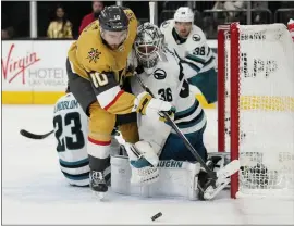  ?? JOHN LOCHER — THE ASSOCIATED PRESS ?? Sharks goaltender Kaapo Kahkonen made 36 saves, including this close-in chance by Nicolas Roy, during Thursday night's 2-1 loss to the Vegas Golden Knights in Las Vegas.