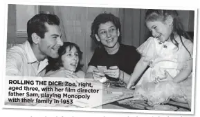  ??  ?? ROLLING THE DICE: Zoe, right, aged three, with her film director father Sam, playing Monopoly with their family in 1953