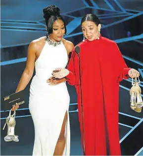  ??  ?? Actors Tiffany Haddish, left, and Maya Rudolph on stage at the 90th Annual Academy Awards at the Dolby Theatre.