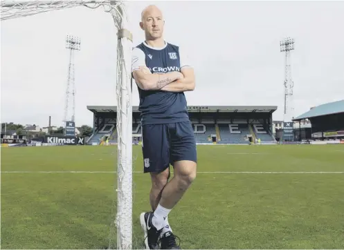  ??  ?? 2 Former Scotland midfielder Charlie Adam was officially unveiled as a Dundee player at Dens Park yesterday.