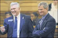  ?? BOB ANDRES / BANDRES@AJC.COM ?? Sen. Ben Watson (right) confers with Sen. Greg Kirk. Watson wants to allow more treatments at private practices, a move hospitals oppose.