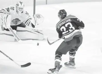  ?? WILFREDO LEE / AP ?? Florida Panthers center Carter Verhaeghe shoots on Chicago Blackhawks goalie Kevin Lankinen during the first period on Saturday in Sunrise.